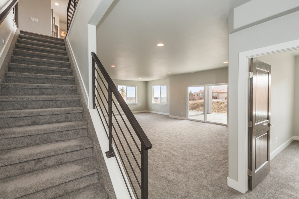 Stairway,To,Basement,With,Modern,Metal,Railing